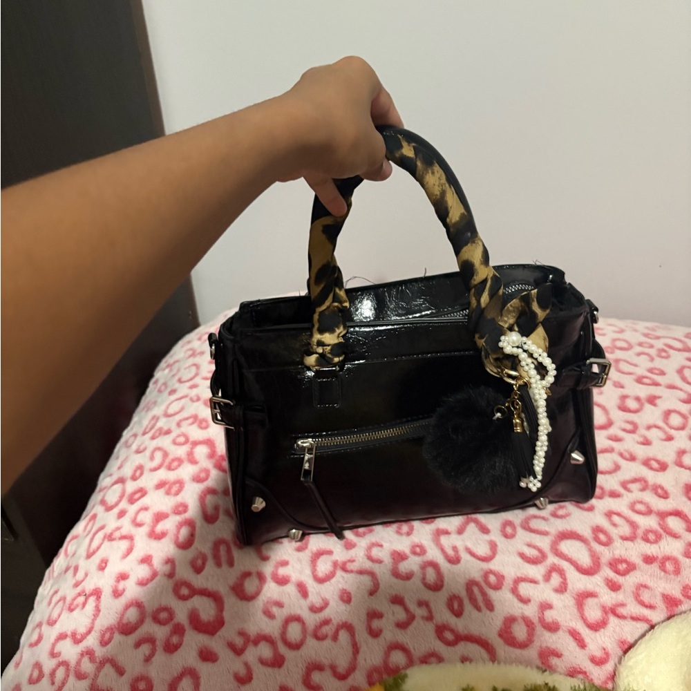 Stylish Black Handbag with Leopard Print Handle